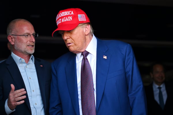 President-elect Donald Trump speaks with talks with Brendan Carr before the launch of the sixth test flight of the SpaceX Starship rocket Tuesday, Nov. 19, 2024 in Brownsville, Texas. (Brandon Bell/Pool via AP)