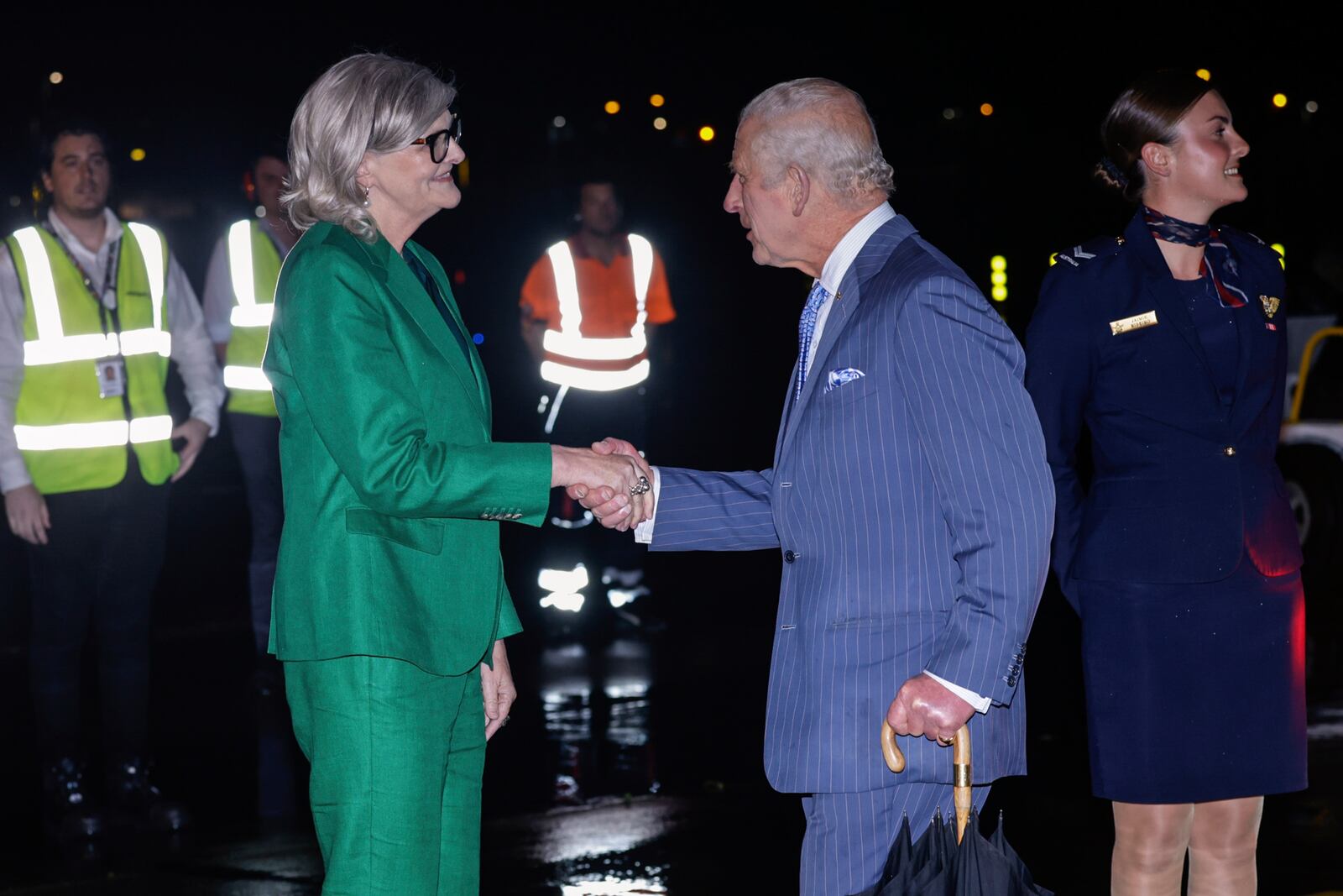 Britain's King Charles meets Ms Sam Mostyn, Governor-General of Australia, on his arrival in Sydney for the start of a five-day tour to Australia, Friday, Oct. 18, 2024. (Brook Mitchell/Pool Photo via AP)