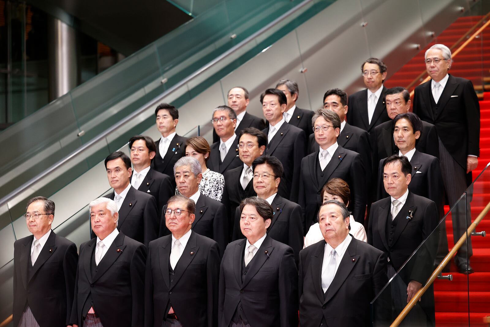 Japan's Prime Minister Shigeru Ishiba, third from right, and his cabinet ministers pose for a photo session at Ishiba's residence in Tokyo, Japan, Tuesday, Oct. 1, 2024. Rodrigo Reyes Marin, Pool Photo via AP)