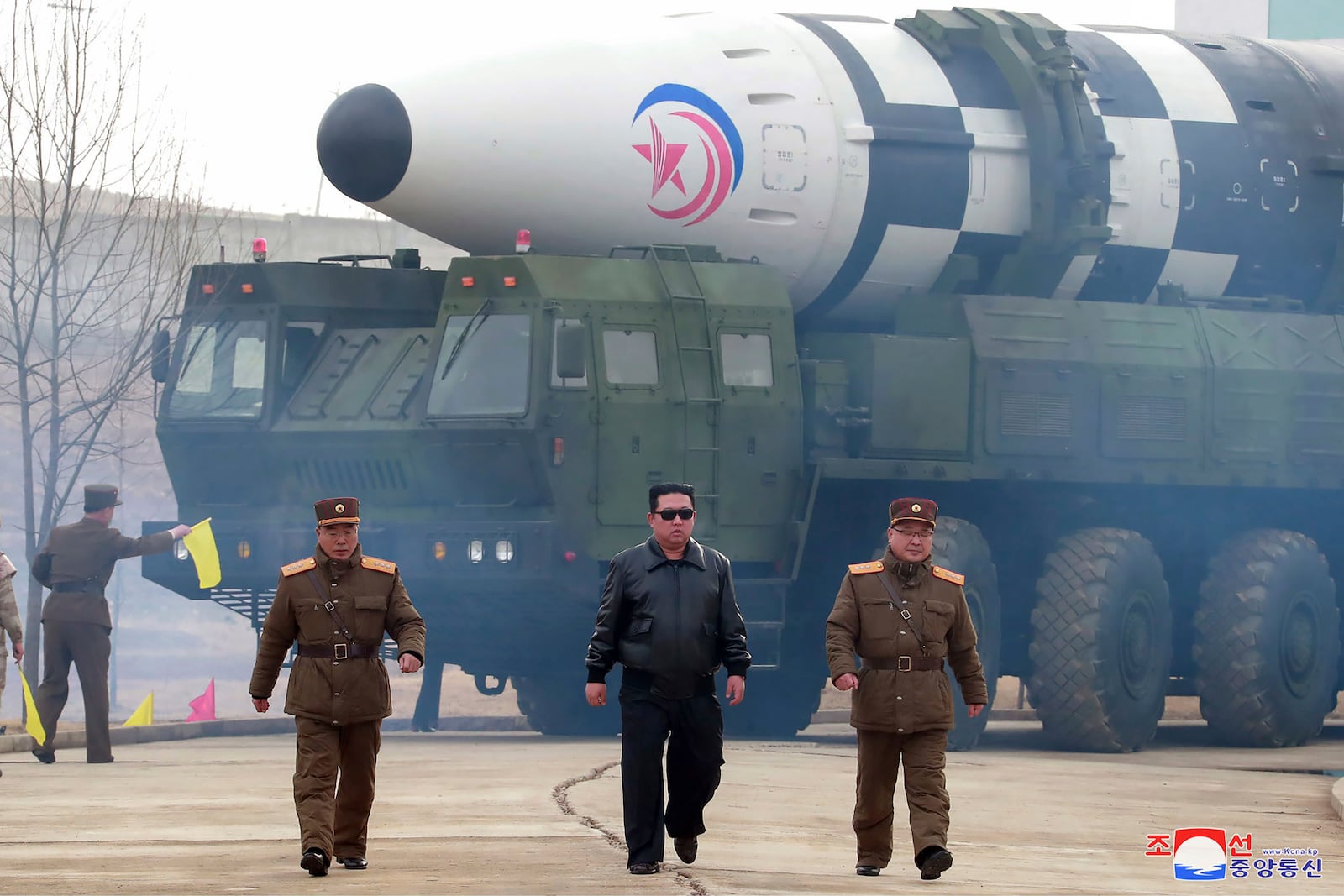 FILE - In this photo distributed by the North Korean government, North Korean leader Kim Jong Un, center, walks around what it says is a Hwasong-17 intercontinental ballistic missile (ICBM) on the launcher at an undisclosed location in North Korea, March 24, 2022. Independent journalists were not given access to cover the event depicted in this image distributed by the North Korean government. The content of this image is as provided and cannot be independently verified. Korean language watermark on image as provided by source reads: "KCNA" which is the abbreviation for Korean Central News Agency. (Korean Central News Agency/Korea News Service via AP, File)