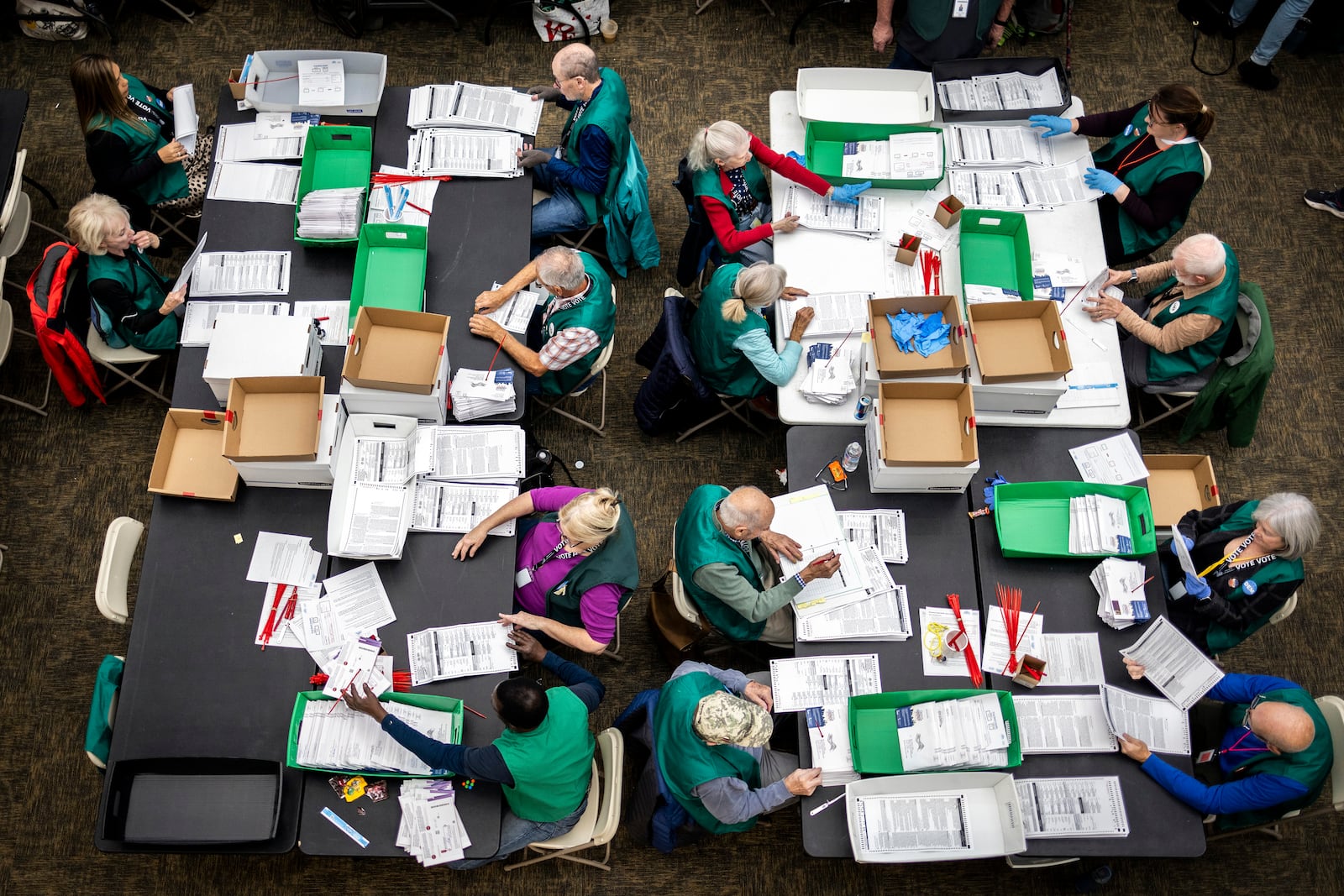 Election workers review ballots at the Denver Elections Division in Denver on Election Day, Tuesday, Nov. 5, 2024. (AP Photo/Chet Strange)