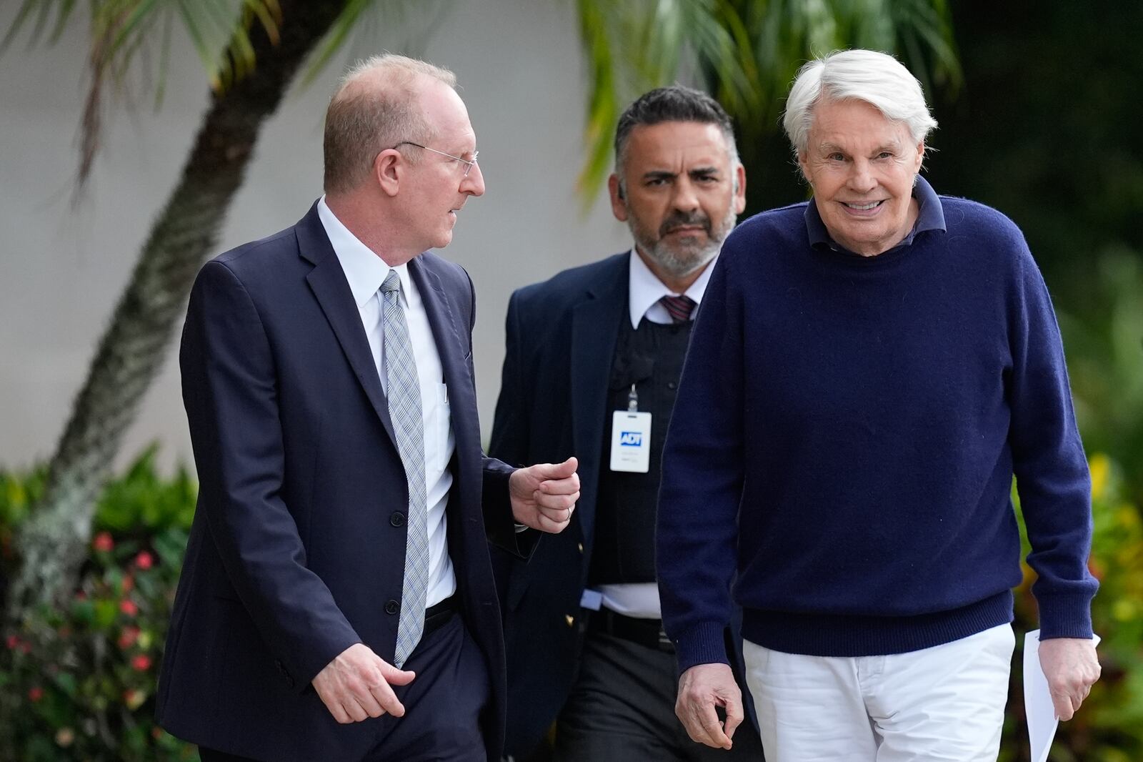 Michael Jeffries, right, former CEO of Abercrombie & Fitch, leaves with his attorney Brian Bieber, left, following a hearing at the Paul G. Rogers Federal Building and U.S. Courthouse, in West Palm Beach, Fla., Tuesday, Oct. 22, 2024. (AP Photo/Rebecca Blackwell)