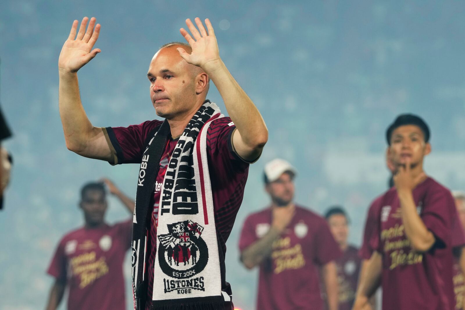 FILE - Vissel Kobe midfielder Andres Iniesta waves towards audience members at the end of a farewell ceremony to commemorate his leaving the club, after his last match with the club against Consadole Sapporo in Kobe, Japan, Saturday, July 1, 2023. Andres Iniesta who scored Spain's World Cup-winning goal in 2010 and was one of the key players who made Barcelona's tiki-taka thrive for so long, announced his retirement from soccer on Tuesday. (AP Photo/Hiro Komae, File)