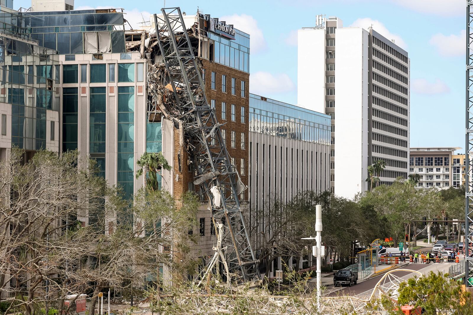 A high rise construction crane broke apart and crashed into the building across the street during Hurricane Milton on Thursday, Oct. 10, 2024, in St. Petersburg, Fla. (AP Photo/Mike Carlson)