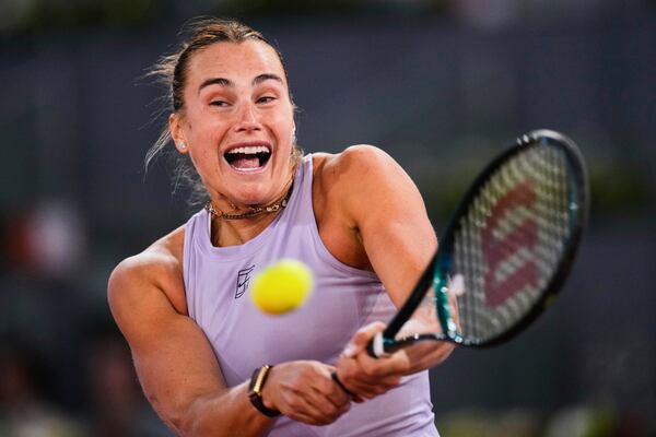 Aryna Sabalenka of Belarus, hits a return to United States' Peyton Stearns during the Madrid Open tennis tournament in Madrid, Spain, Tuesday, April 29, 2025. (AP Photo/Manu Fernandez)