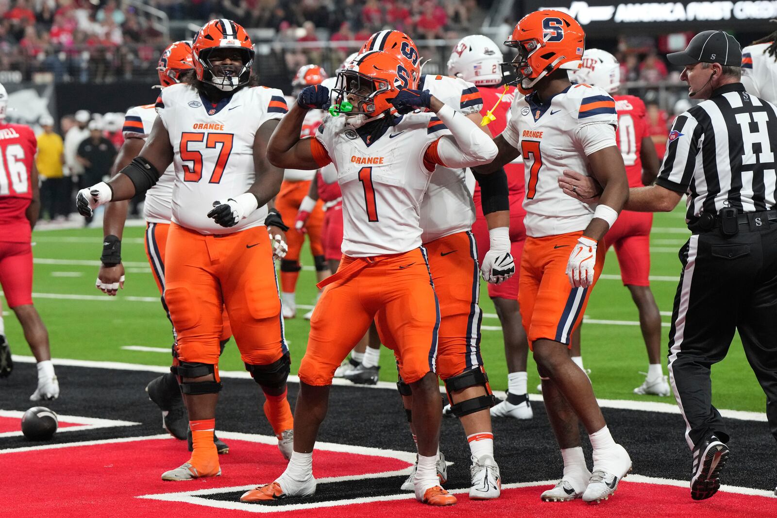 Syracuse running back LeQuint Allen (1) celebrates with teammates after scoring a touchdown against UNLV in the first half during an NCAA college football game, Friday, Oct. 4, 2024, in Las Vegas. (AP Photo/Rick Scuteri)