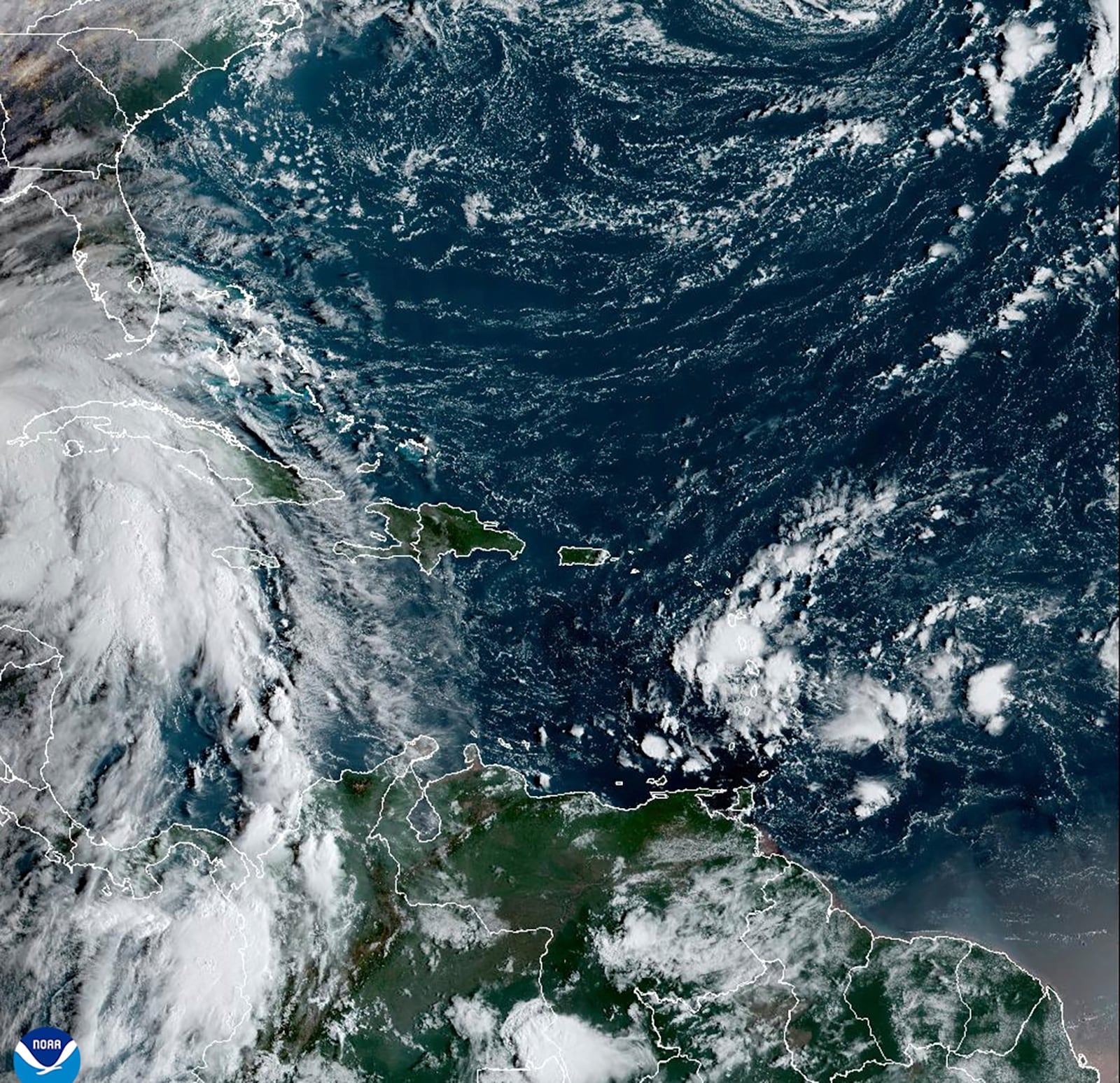 This satellite image provided by NOAA shows Tropical Storm Helene in the Caribbean Sea on Wednesday, Sept. 25, 2024. (NOAA via AP)