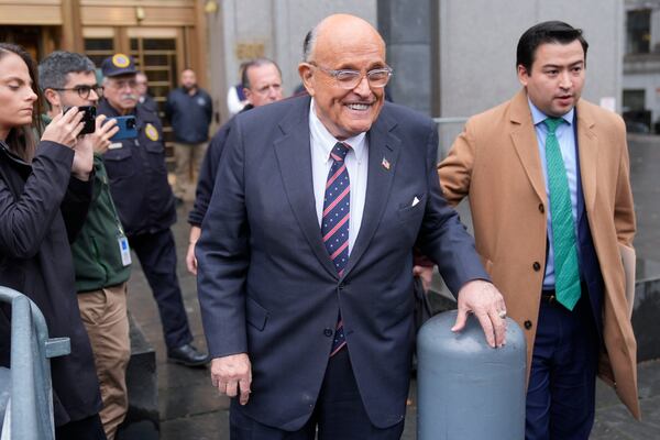 Rudy Giuliani speaks to reporters as he leaves the federal courthouse in New York, Tuesday, Nov. 26, 2024. (AP Photo/Seth Wenig)