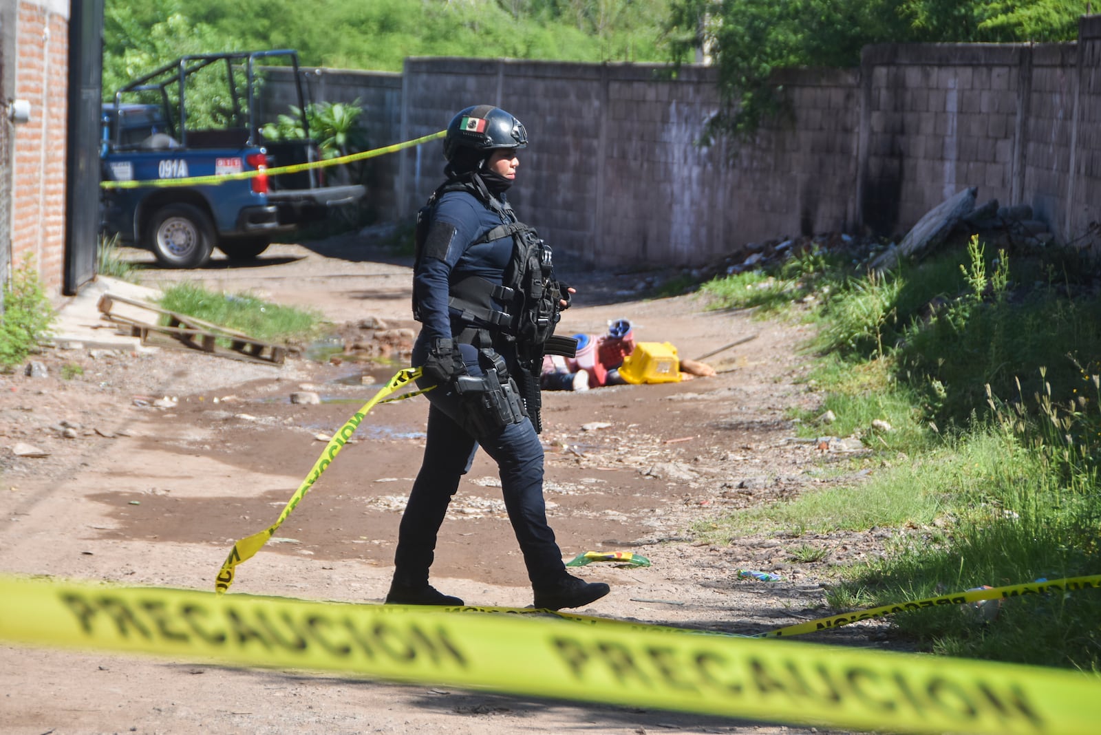 Police work in the area where bodies lie on the ground in Culiacan, Sinola state, Mexico, Tuesday, Sept. 17, 2024. (AP Photo)