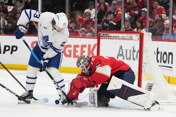Florida Panthers goaltender Sergei Bobrovsky, right, defends the goal against Toronto Maple Leafs left wing Matthew Knies (23) during the second period in Game 6 of a second-round NHL hockey playoff series, Friday, May 16, 2025, in Sunrise, Fla. (AP Photo/Lynne Sladky)