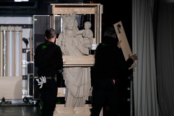 The original Virgin Mary statue, which did not suffer from the 2019 fire, is displayed before returning in the Notre-Dame cathedral, Friday, Nov. 15, 2024 outside the cathedral in Paris. (AP Photo/Louise Delmotte)