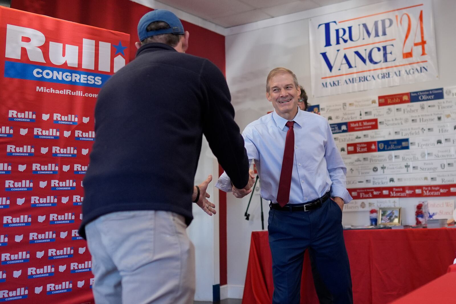 Rep. Jim Jordan, R-Ohio, right, shakes hands with Rep. Michael Rulli, R-Ohio, as he is introduced at a rally at the Mahoning County Republican Party headquarters in Boardman, Ohio, Thursday, Oct. 17, 2024. (AP Photo/Carolyn Kaster)