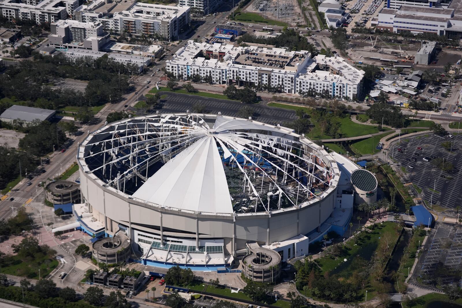 The destroyed roof of the Tropicana Dome is seen in the aftermath of Hurricane Milton, Thursday, Oct. 10, 2024, in St. Petersburg, Fla. (AP Photo/Gerald Herbert)