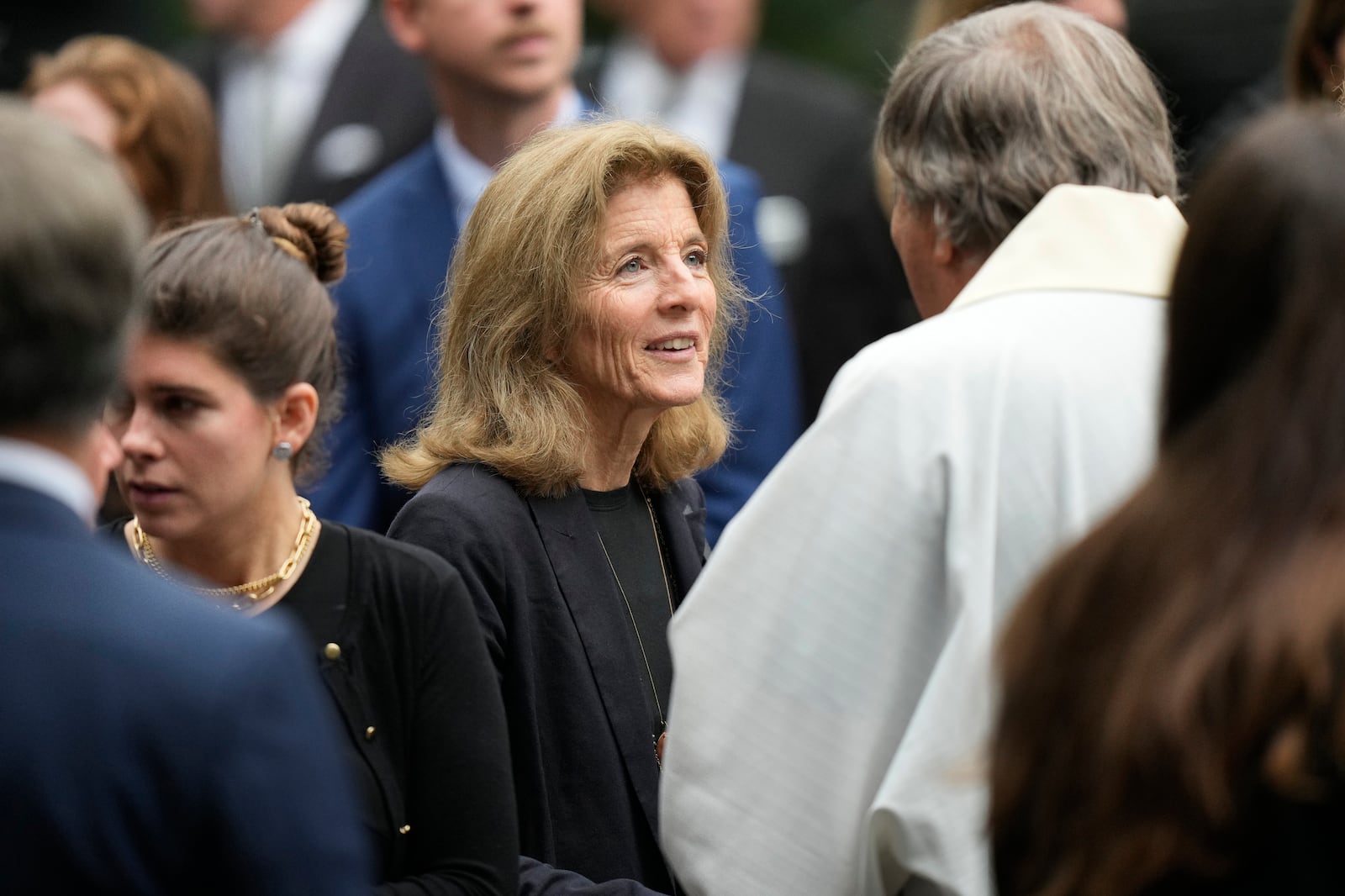 Caroline Kennedy, center, daughter of Pres. John F. Kennedy, speaks with people as she departs Our Lady of Victory church following funeral services for Ethel Kennedy, wife of Sen. Robert F. Kennedy, Monday, Oct. 14, 2024, in Centerville, Mass. (AP Photo/Steven Senne)