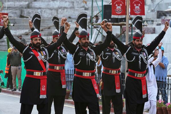 Pakistan's Rangers soldiers gesture during a daily closing ceremony at the Wagah, a joint post on the Pakistan and India border, near Lahore, Pakistan, Saturday, May 3, 2025. (AP Photo/K.M. Chaudary)