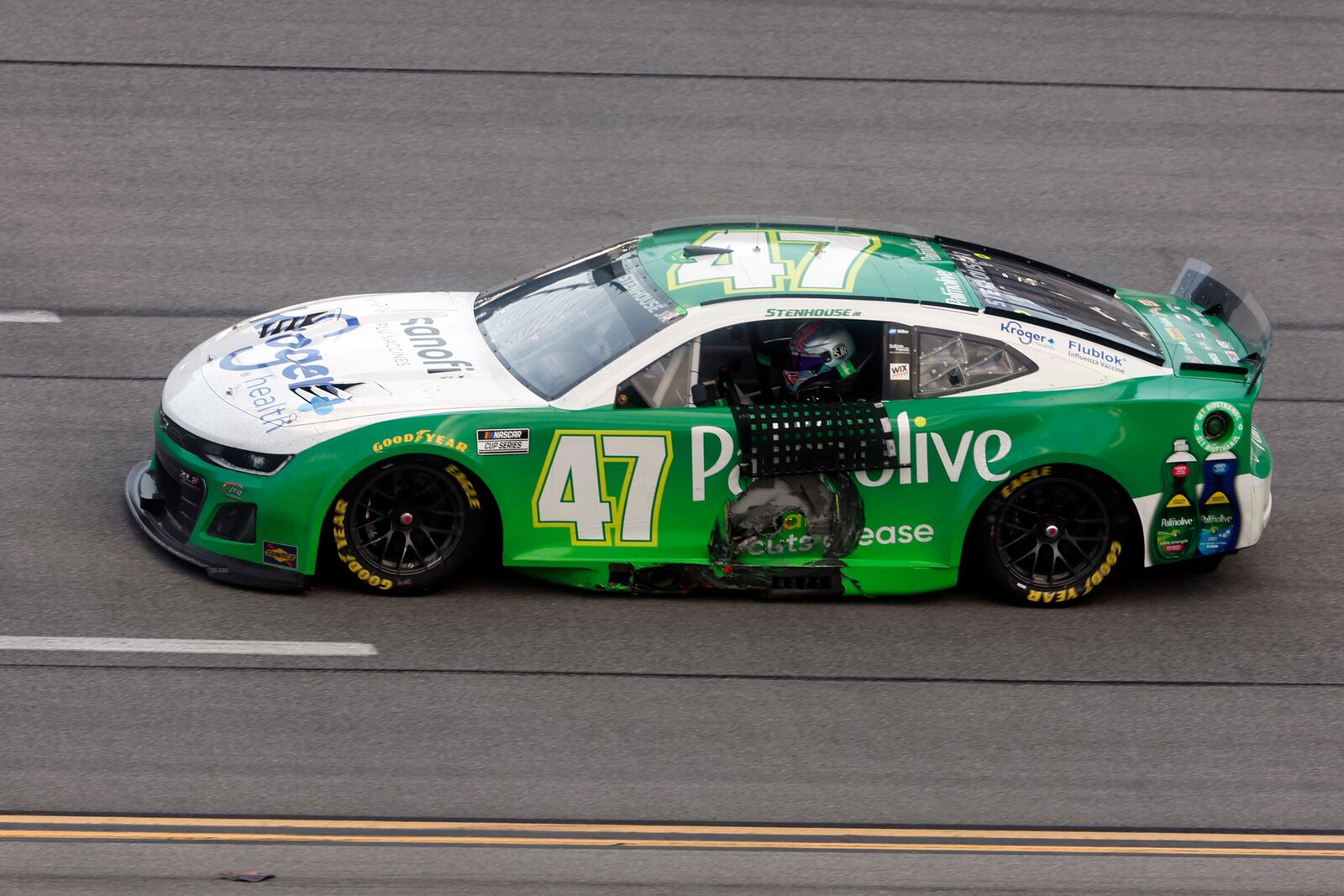 Driver Ricky Stenhouse Jr. drives by the grand stands after winning a NASCAR Cup Series auto race at Talladega Superspeedway, Sunday, Oct. 6, 2024, in Talladega, Ala. (AP Photo/ Butch Dill)