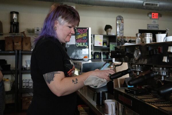 Renee Colon, co-owner of Fuego Coffee Roasters, uses a coffee machine, Saturday, March 22, 2025, in Rochester, N.Y. (Max Conway via AP)