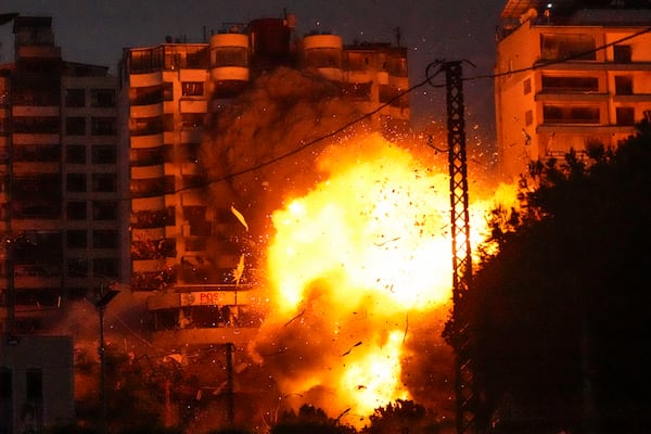 Thick smoke and flames erupt from an Israeli airstrike in Tayouneh, Beirut, Lebanon, Monday, Nov. 25, 2024. (AP Photo/Hassan Ammar)