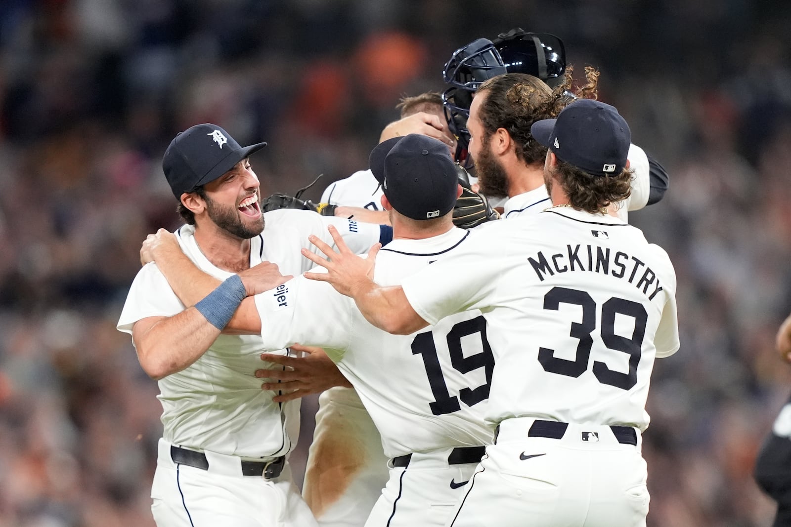 Members of the Detroit Tigers celebrate after the ninth inning of a baseball game against the Chicago White Sox, Friday, Sept. 27, 2024, in Detroit. (AP Photo/Carlos Osorio)