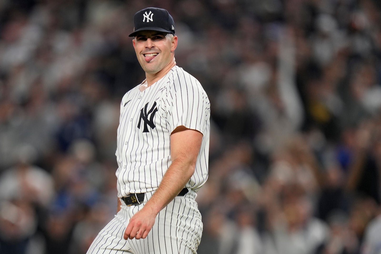 New York Yankees pitcher Carlos Rodón (55) reacts after striking out the batter during the first inning of Game 2 of the American League baseball playoff series against the Kansas City Royals, Monday, Oct. 7, 2024, in New York. (AP Photo/Seth Wenig)