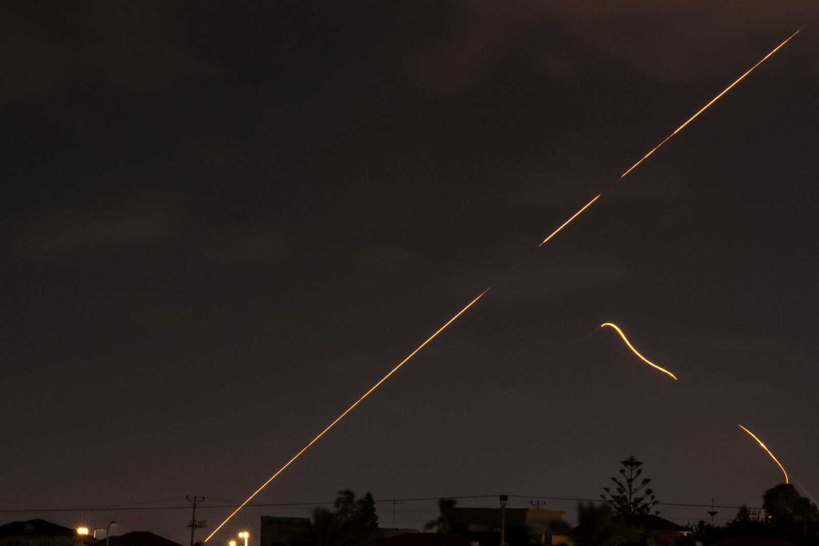 Israeli air defense system fires to intercept missiles over Hadera, Israel Tuesday, Oct. 1, 2024. (AP Photo/Ariel Schalit)