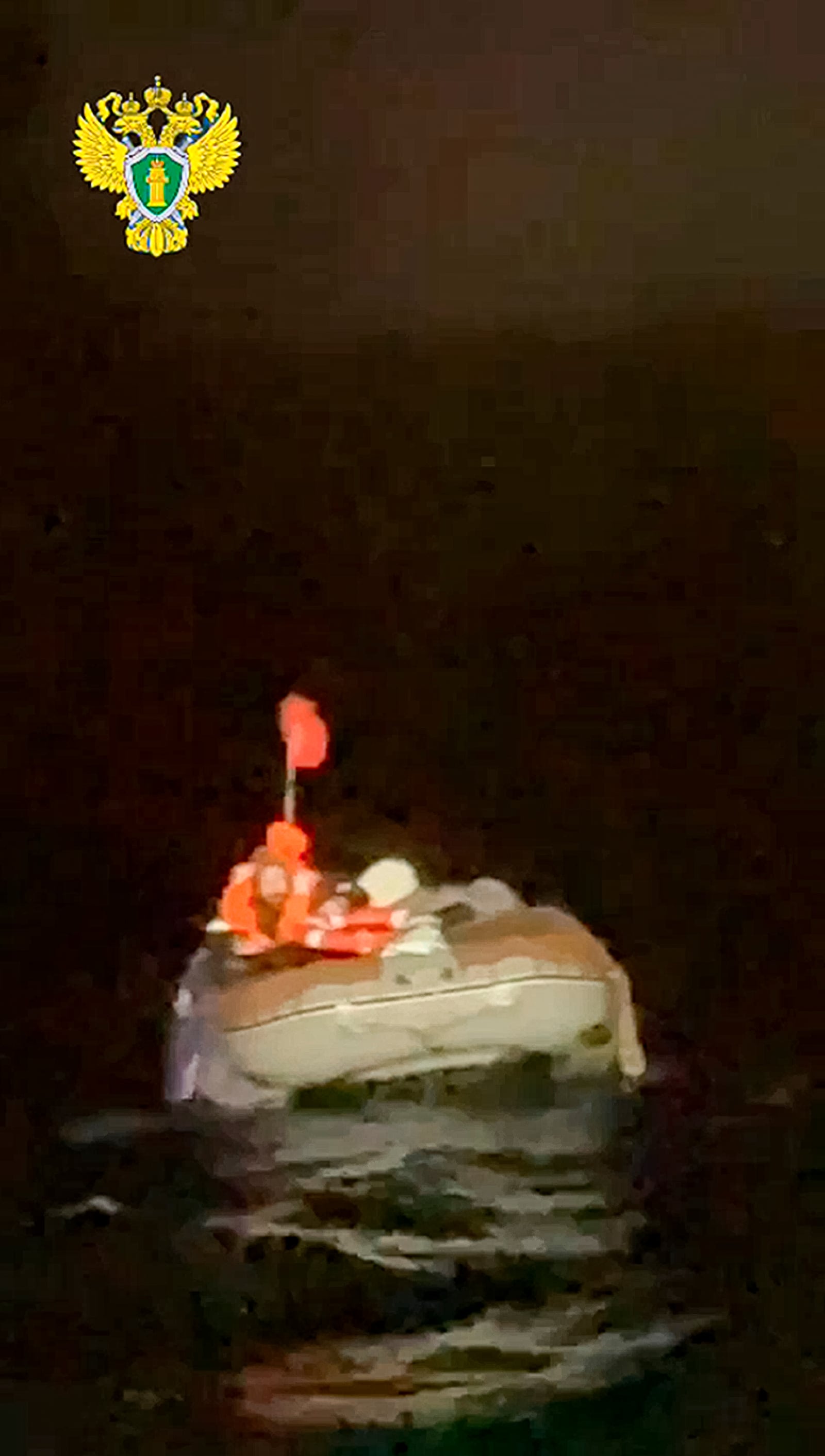 In this photo taken from video released by the official telegram channel of the Russian Far Eastern Transport Prosecutor's Office on Tuesday, Oct. 15, 2024, a Russian man who spent more than two months adrift in an inflatable boat is seen before being rescued by a fishing vessel in the Okhotsk Sea near the village of Ust-Khairuzovo in Kamchatka region of Russian far east. (Official telegram channel of the Russian Far Eastern Transport Prosecutor's Office via AP)