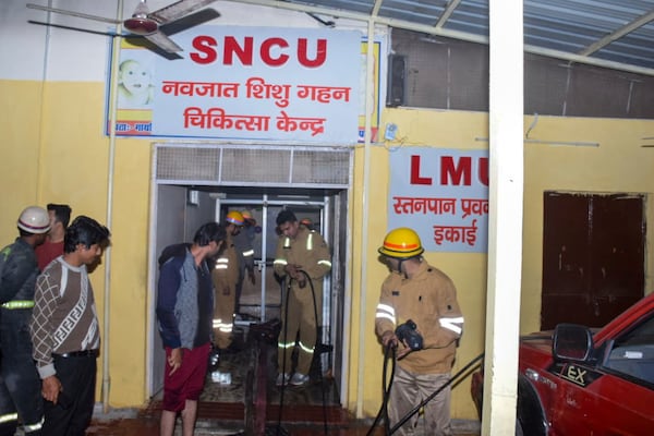 Firefighters work after a fire broke out in a neonatal intensive care unit at Jhansi Medical College hospital, in Jhansi, India, Friday, Nov. 15, 2024. (AP Photo)