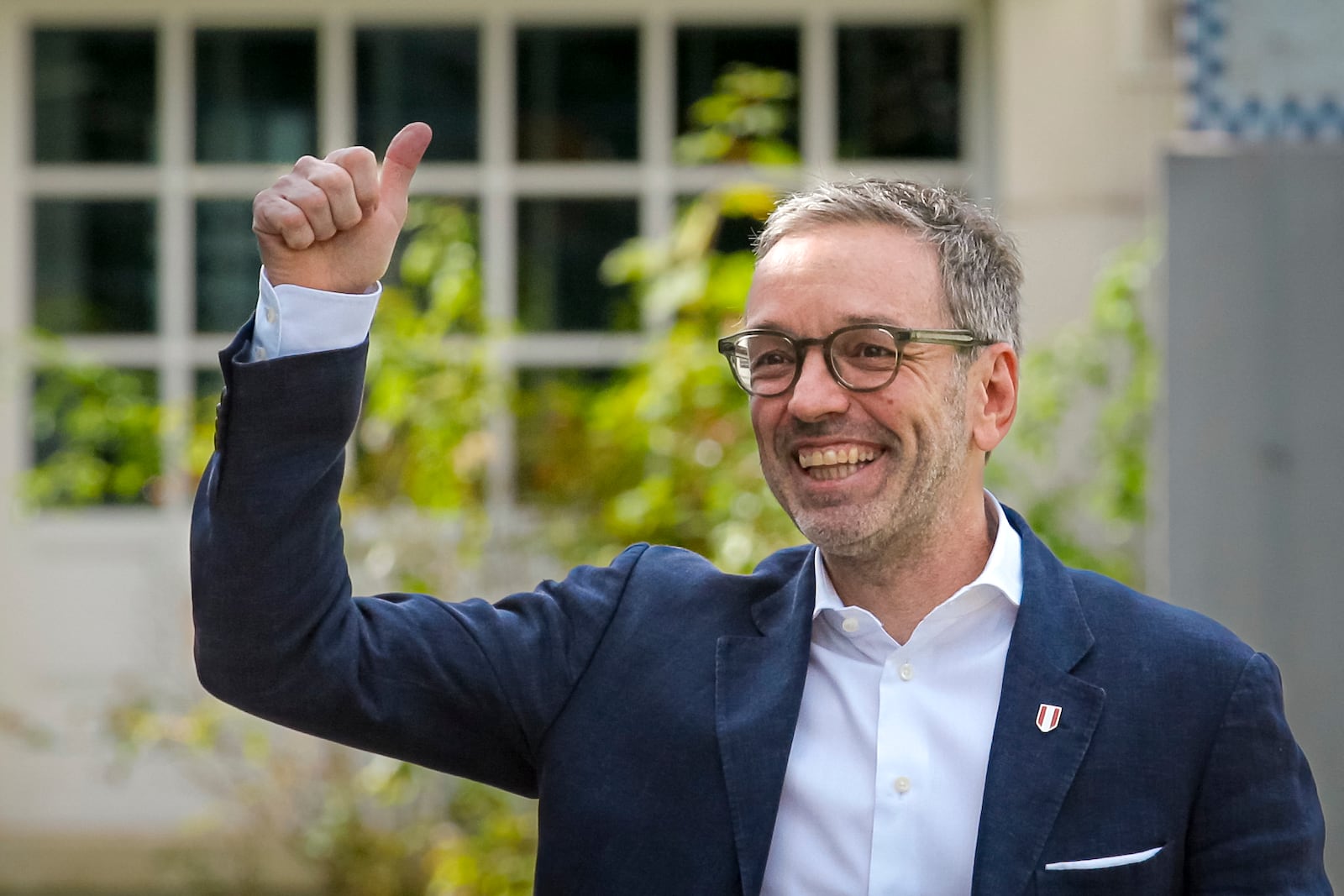 Herbert Kickl, leader of the Freedom Party of Austria gives a thumbs-up as he arrives at a polling station in Purkersdorf, Austria, Sunday, Sept. 29, 2024, to cast his vote in the country's national election. (AP Photo/Heinz-Peter Bader)