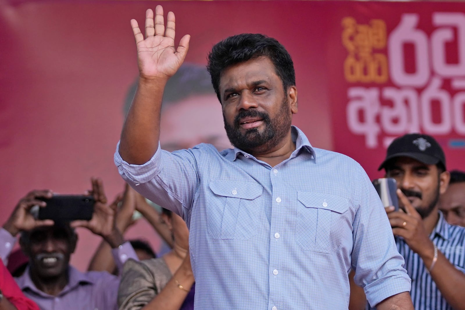 FILE -Leader and the presidential candidate of National People's Power Anura Kumara Dissanayake waves to supporters during a public rally in Dehiowita, Sri Lanka, Sept. 17, 2024. (AP Photo/Eranga Jayawardena, File)