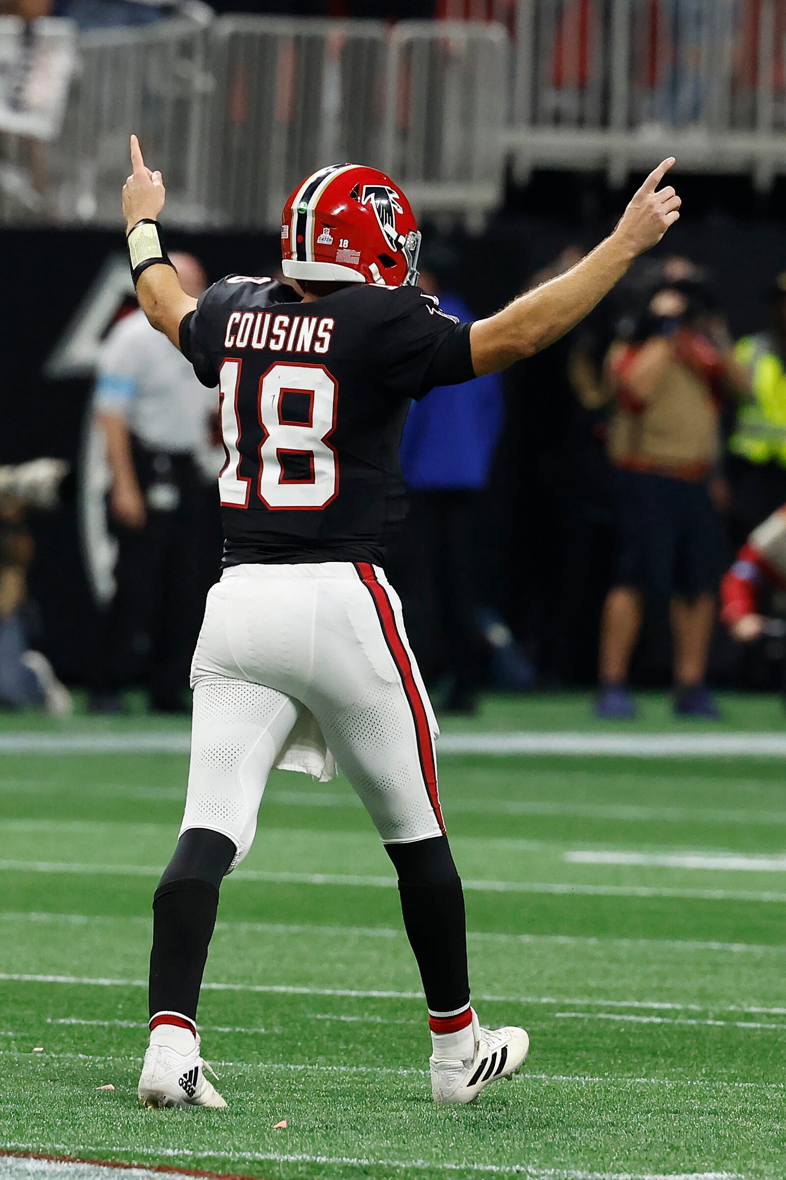 Atlanta Falcons quarterback Kirk Cousins (18) celebrates after throwing a game-wining touchdown pass to wide receiver KhaDarel Hodge against the Tampa Bay Buccaneers during overtime in an NFL football game Thursday, Oct. 3, 2024, in Atlanta. (AP Photo/Butch Dill)