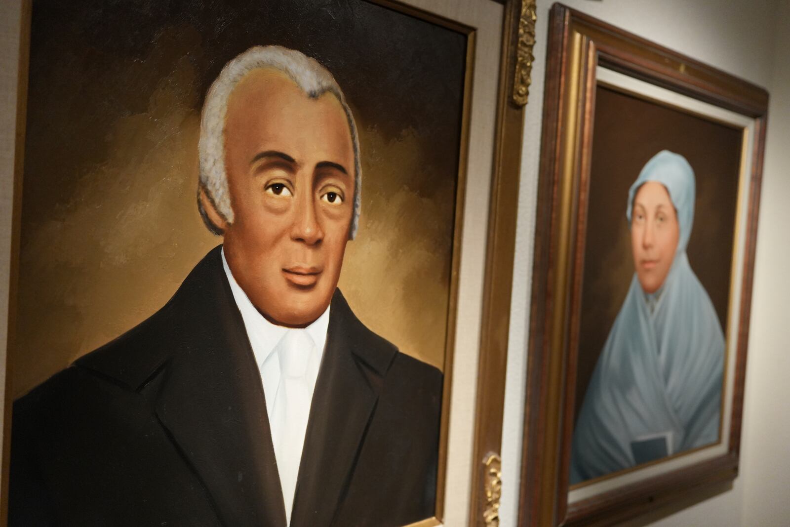 Portraits of Mother Bethel AME Church founder the Rev. Richard Allen and his wife, Sarah, are displayed on a wall at the church’s museum in Philadelphia, on Sunday, Sept. 29, 2024. (AP Photo/Luis Andres Henao)