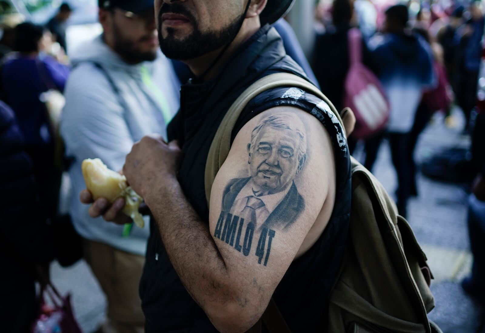 FILE - A supporter of Mexican President Andres Manuel Lopez Obrador sporting a tattoo of the president arrives for a march to show support for Lopez Obrador's administration in Mexico City, Nov. 27, 2022. (AP Photo/Eduardo Verdugo, File)