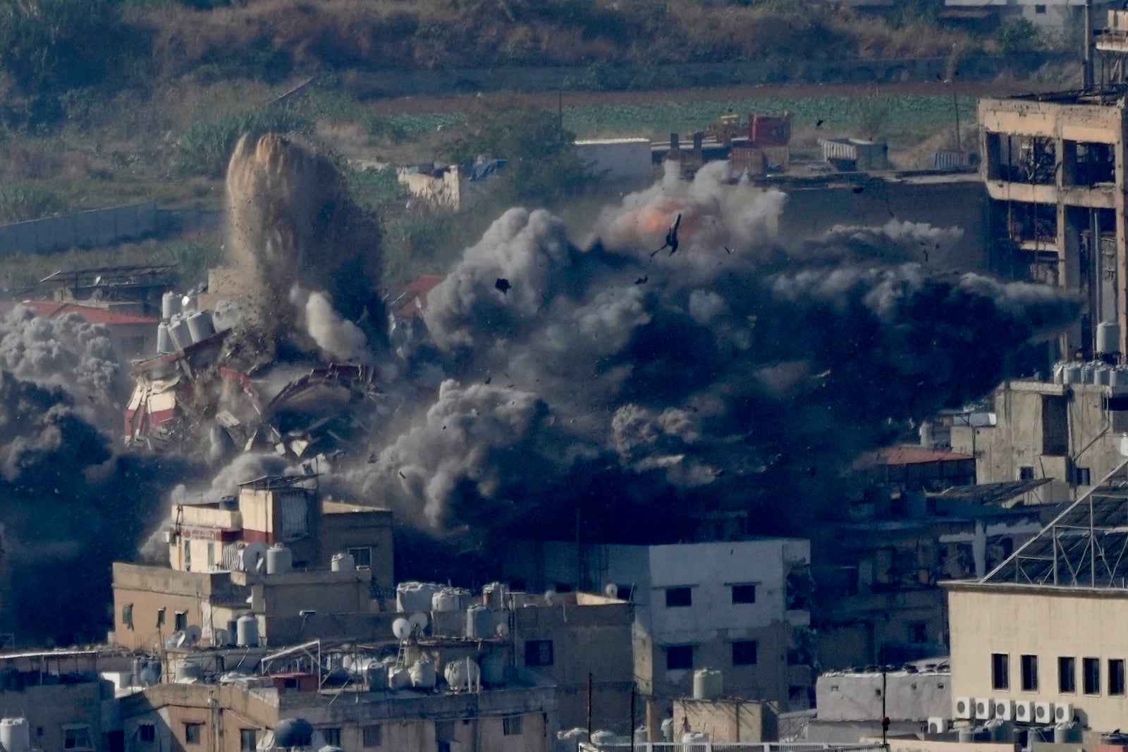 Smoke rises from a building hit in an Israeli airstrike in Dahiyeh, in the southern suburb of Beirut, Lebanon, Thursday, Nov. 14, 2024. (AP Photo/Hussein Malla)