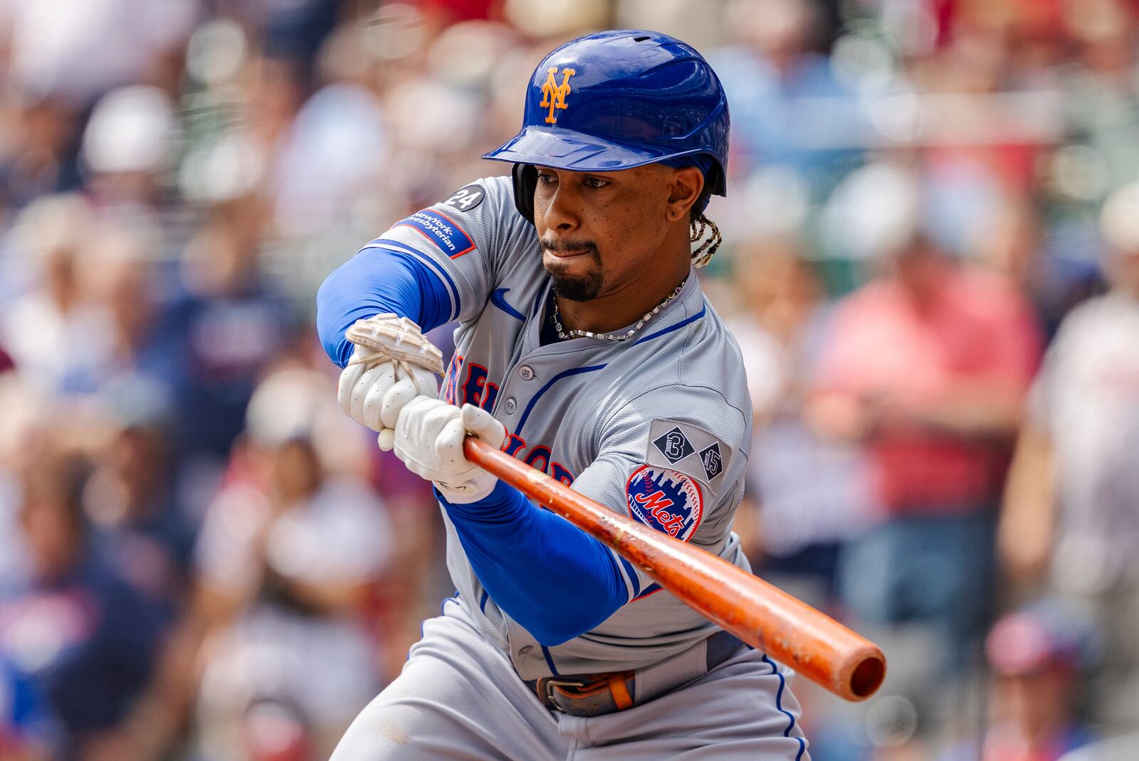 New York Mets' Francisco Lindor checks his swing in the third inning of a baseball game against the Atlanta Braves, Monday, Sept. 30, 2024, in Atlanta. (AP Photo/Jason Allen)