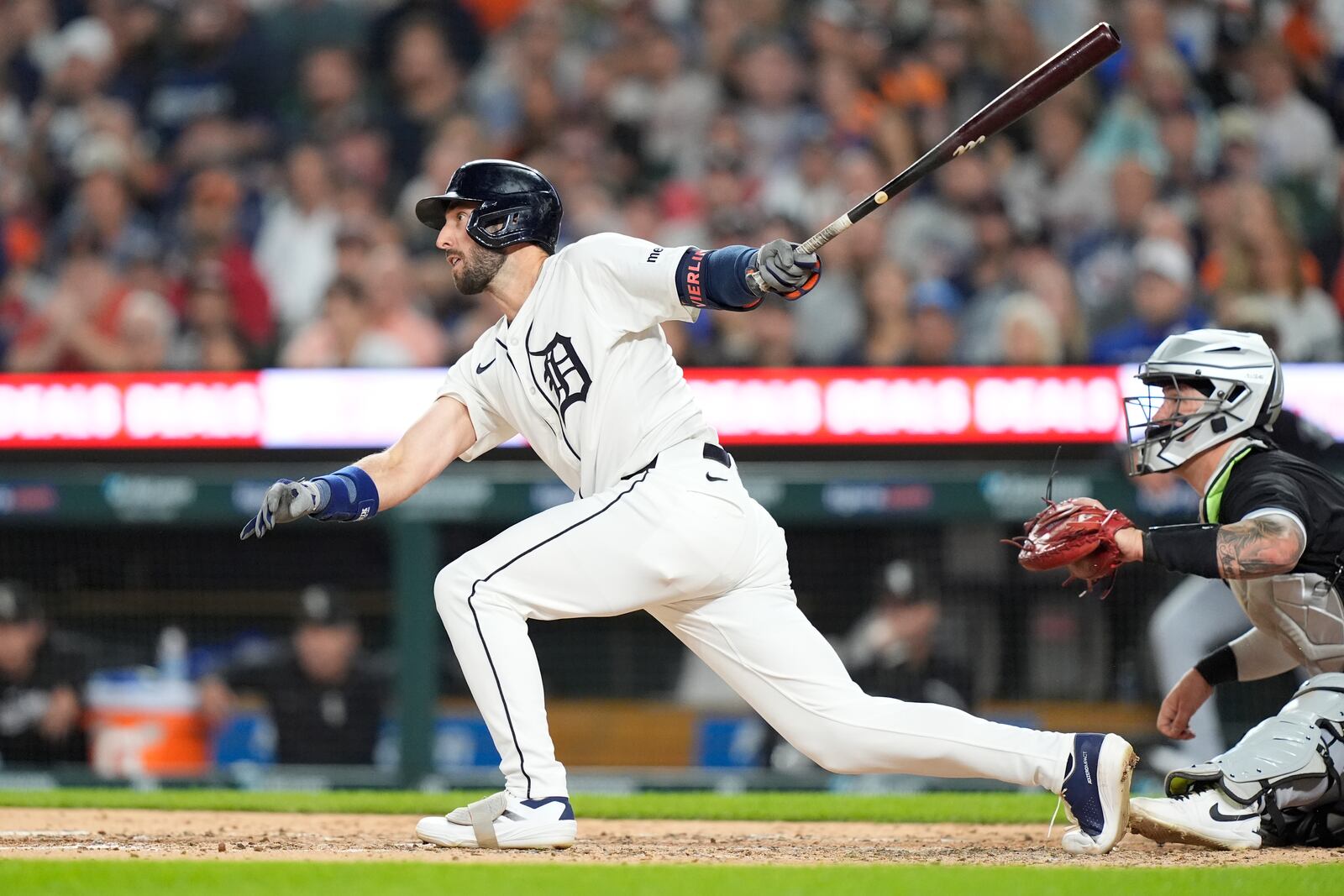 Detroit Tigers' Matt Vierling hits a sacrifice fly to score Parker Meadows during the fifth inning of a baseball game, Friday, Sept. 27, 2024, in Detroit. (AP Photo/Carlos Osorio)