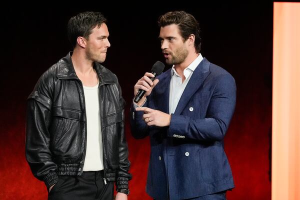 Nicholas Hoult, left, and David Corenswet, cast members of the upcoming film "Superman," speak during the Warner Bros. Pictures presentation at CinemaCon on Monday, April 1, 2025, at Caesars Palace in Las Vegas. (AP Photo/Chris Pizzello)