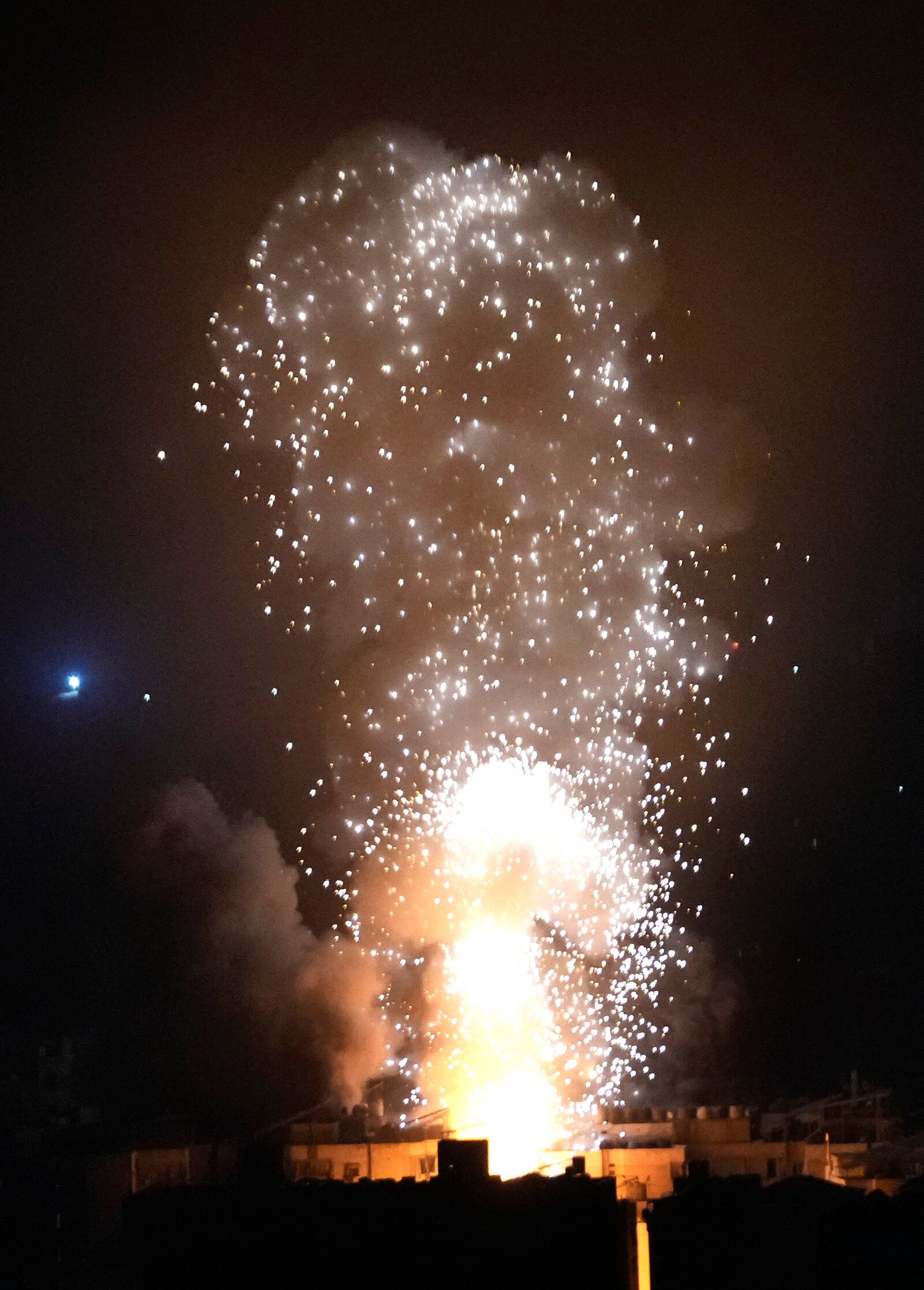 Flames and smoke rise from an Israeli airstrike in Dahiyeh, Beirut, Lebanon, early Sunday, Oct. 6, 2024. (AP Photo/Hussein Malla)