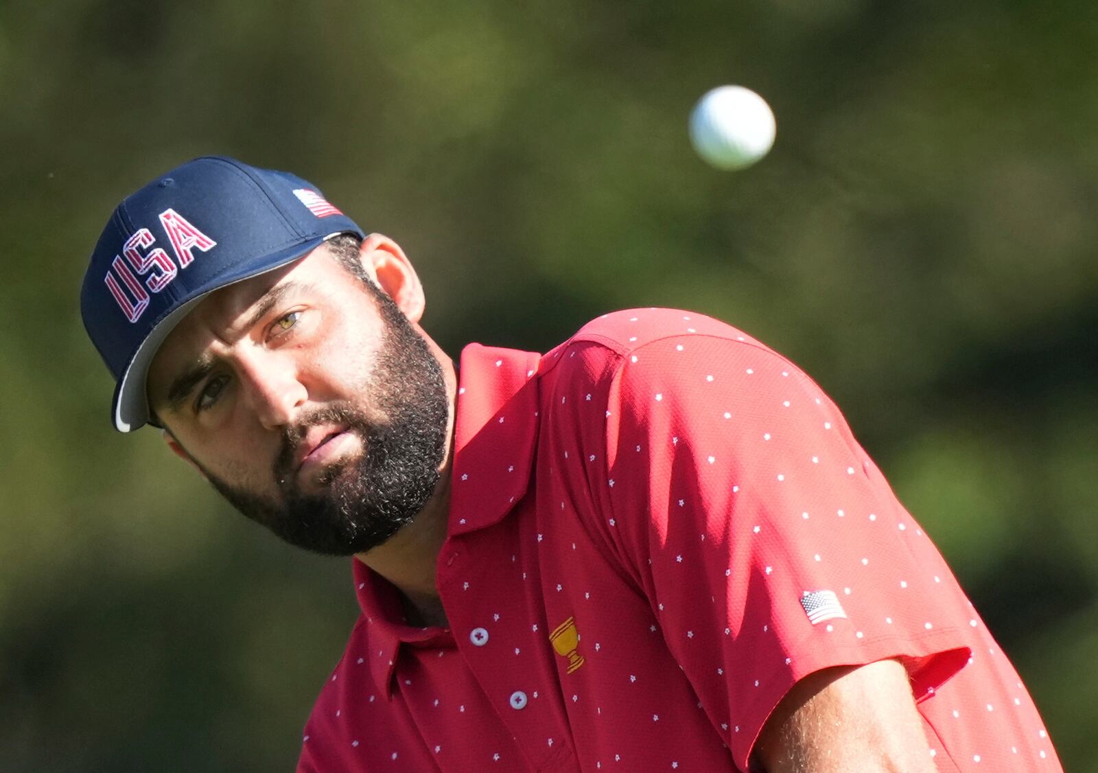 United States team member Scottie Scheffler chips onto the 5th green during their fifth round singles match at the Presidents Cup golf tournament at Royal Montreal Golf Club on Sunday, Sept. 29, 2024, in Montreal. (Frank Gunn/The Canadian Press via AP)