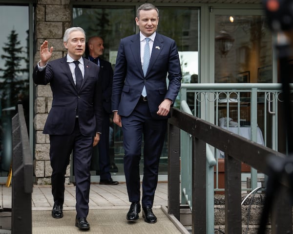 Ukraine Minister of Finance, Sergii Marchenko, right, and Canada's Finance Minister Francois-Philippe Champagne arrive to speak to the media prior to the G7 Finance Ministers meeting in Banff, Alberta, Tuesday, May 20, 2025. (Jeff McIntosh/The Canadian Press via AP)