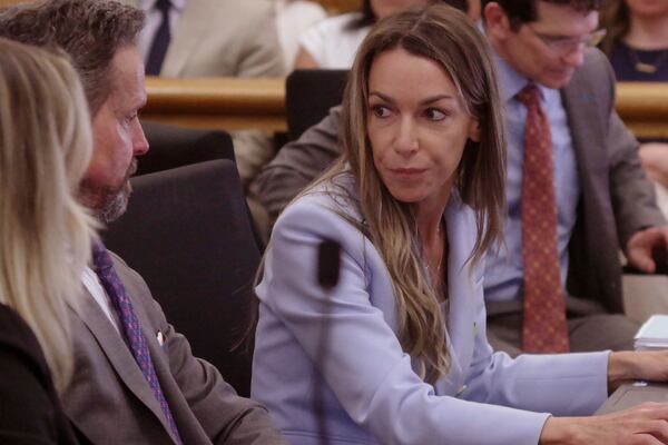 Defendant Karen Read talks with her attorneys during her murder trial in Norfolk Superior Court in Dedham, Mass., Wednesday, May 14, 2025. (Mark Chavous/Enterprise News via AP, Pool)