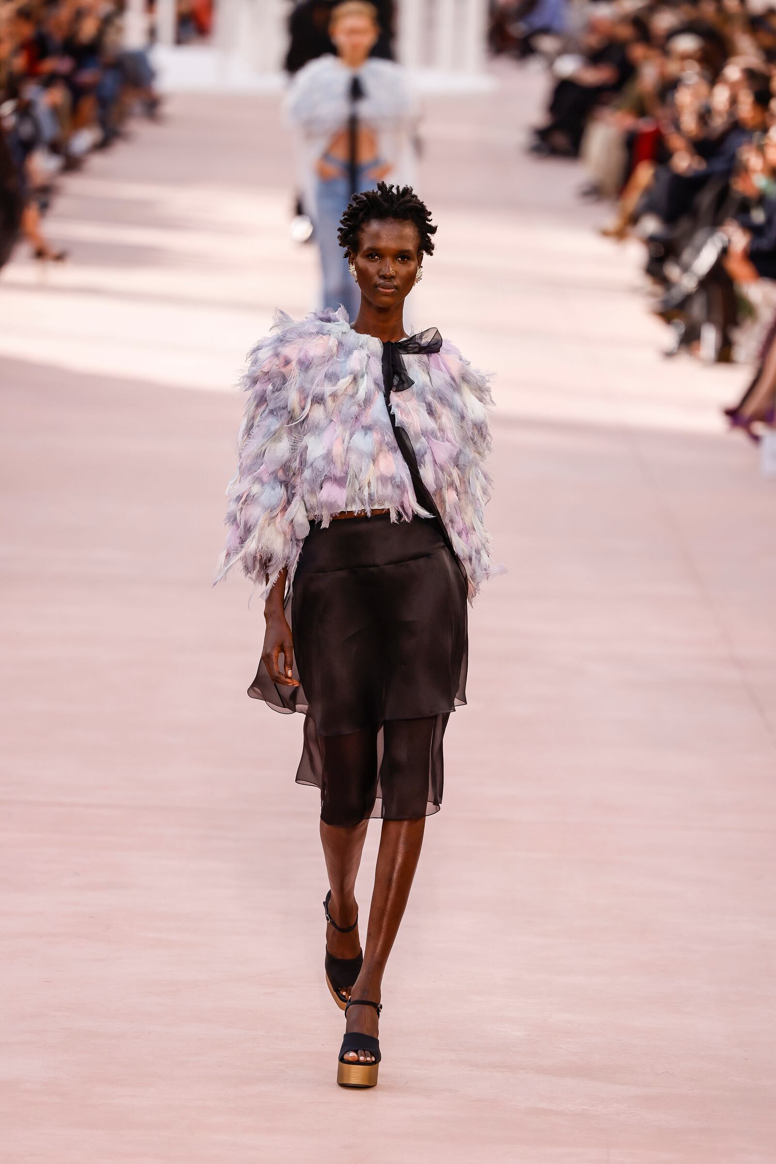 A model wears a creation as part of the Chanel Spring/Summer 2025 collection presented Tuesday, Oct. 1, 2024, in Paris. (Photo by Vianney Le Caer/Invision/AP)