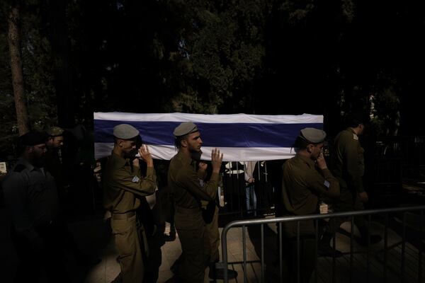 Israeli soldiers carry the coffin of combat engineer squad commander Staff Sgt. Zamir Burke, 20, from Beit Shemesh, during his funeral at Mount Herzl military cemetery in Jerusalem, Israel, Sunday Nov. 1, 2024. Burke was killed in combat with Hamas at the Jabaliya refugee camp in Gaza. (APcPhoto/Mahmoud Illean)