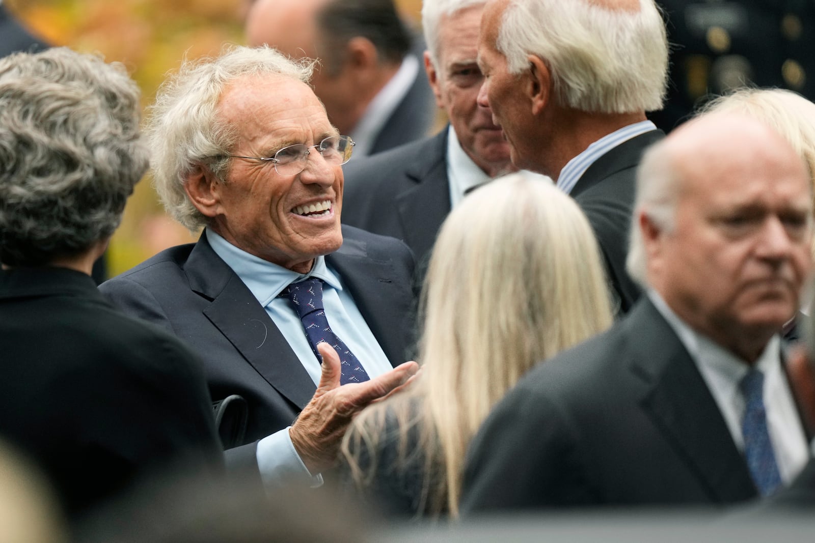 Former Massachusetts U.S. Rep. Joseph Kennedy II, center left, son of the late Ethel Kennedy, speaks with fellow mourners outside Our Lady of Victory church, following funeral services for Ethel Kennedy, Monday, Oct. 14, 2024, in Centerville, Mass. (AP Photo/Steven Senne)