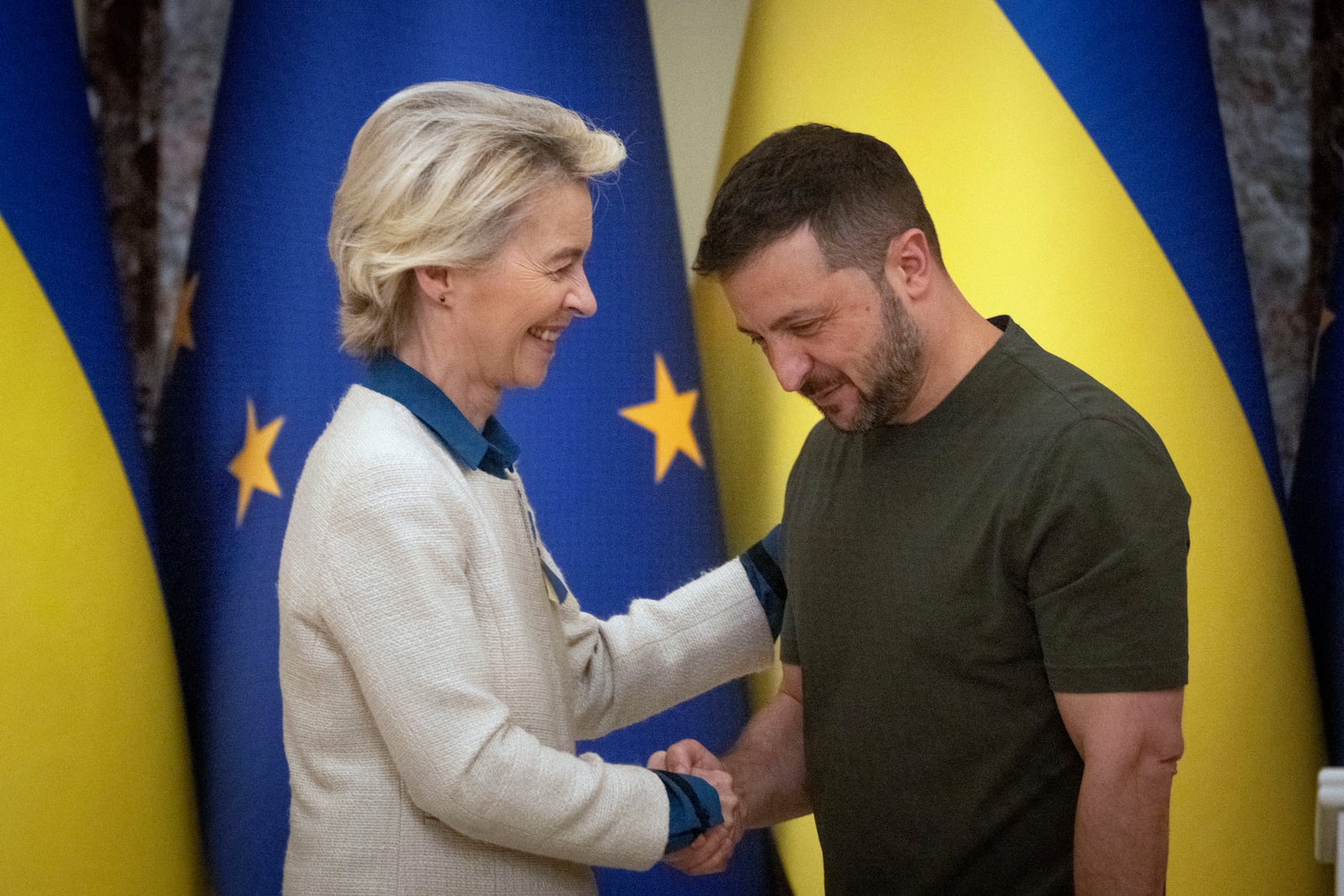 Ukrainian President Volodymyr Zelenskyy, right, and European Commission President Ursula von der Leyen greet each other in Kyiv, Ukraine, Friday, Sept. 20, 2024. (AP Photo/Efrem Lukatsky)