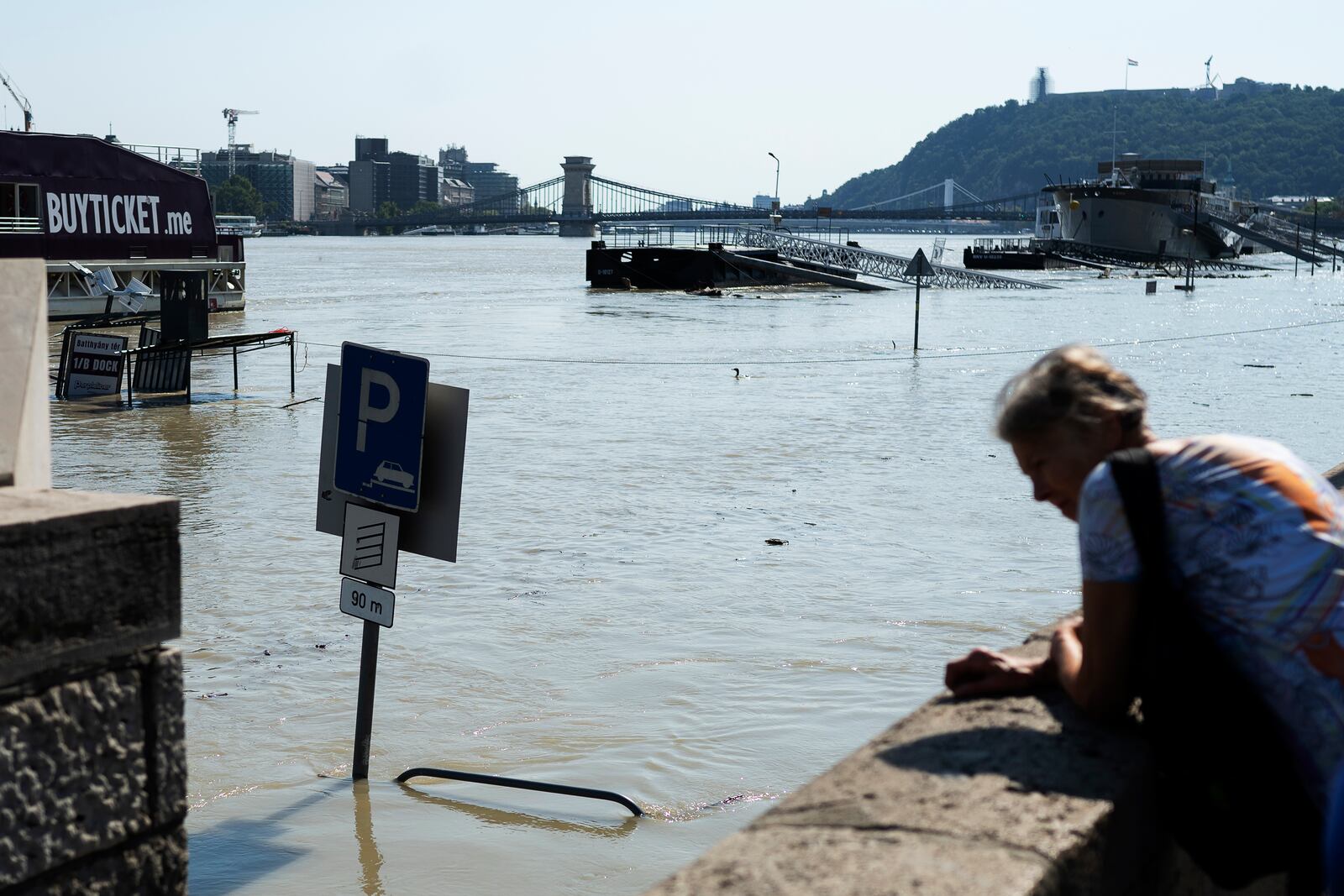 People watch the Danube river as it floods it's banks in central Budapest, Hungary, Thursday, Sept. 19, 2024. (AP Photo/Denes Erdos)