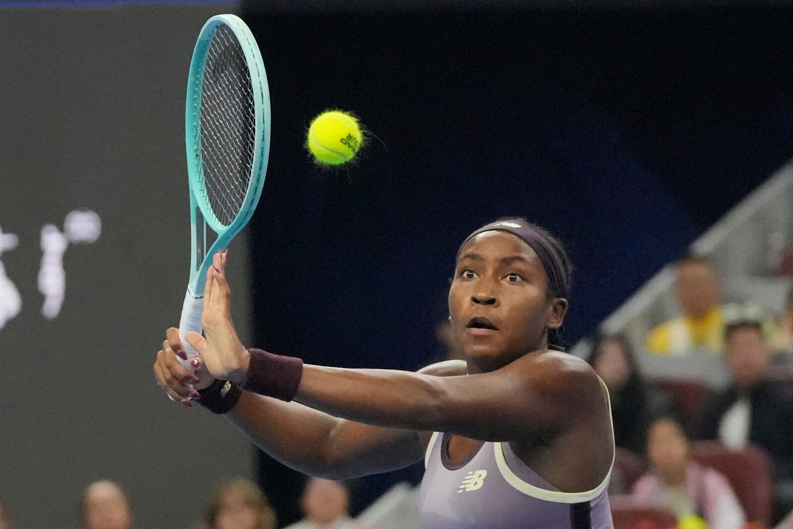 Coco Gauff of the United States returns a shot to Karolina Muchova of Czech Republic during the women's singles final match at the China Open tennis tournament at the National Tennis Center in Beijing, Sunday, Oct. 6, 2024. (AP Photo/Achmad Ibrahim)