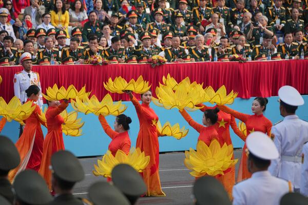 Vietnamese dancers perform during a parade celebrating the 50th anniversary of the end of the Vietnam War in Ho Chi Minh City, Vietnam, Wednesday, April 30, 2025. (AP Photo/Achmad Ibrahim)