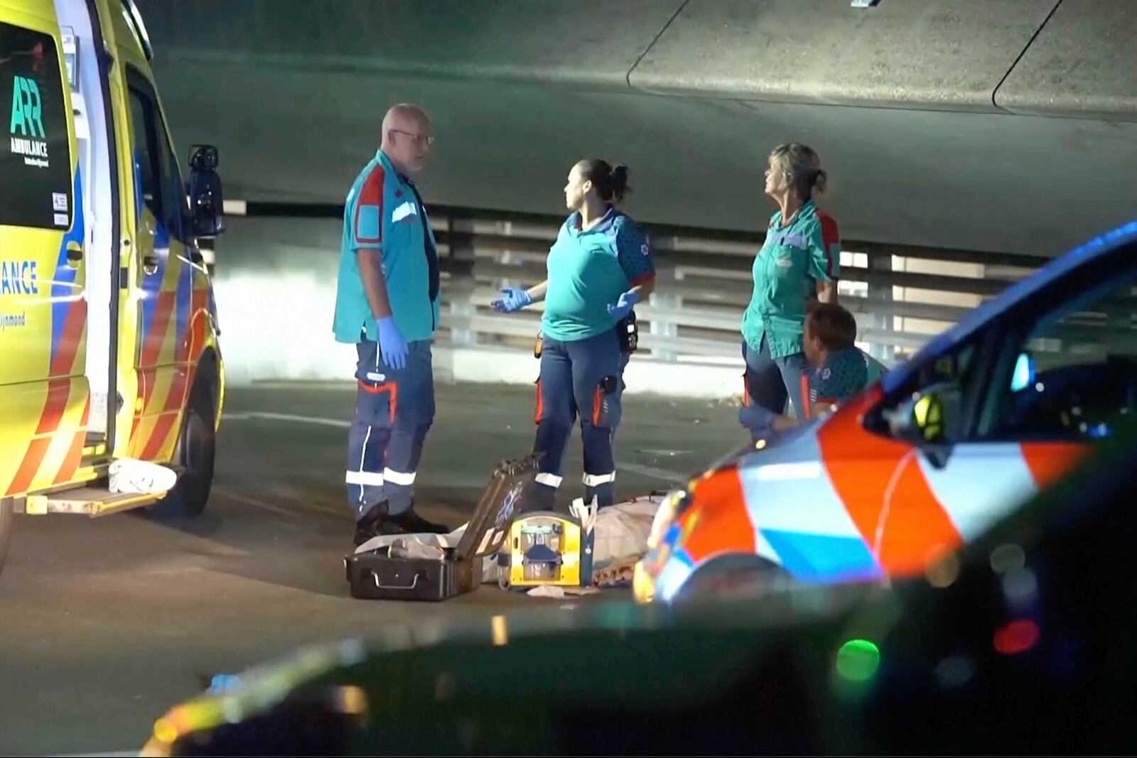 In this image made from video provided by Media TV, personnel respond to a stabbing incident late Thursday, Sept. 19, 2024, in the port city of Rotterdam, Netherlands. (Media TV via AP)