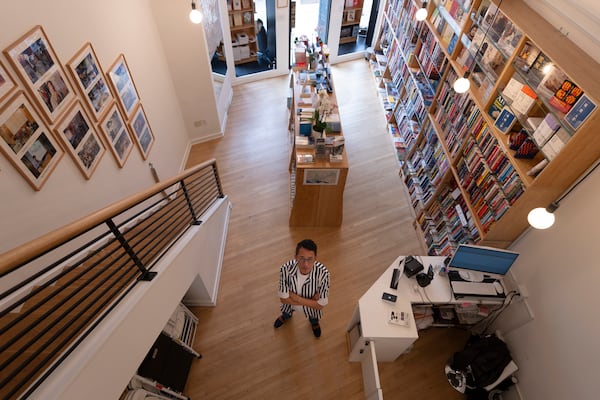 Yu Miao, owner of JF Books, poses for a photograph in his bookstore in Washington, Thursday, Oct. 3, 2024. (AP Photo/Ben Curtis)