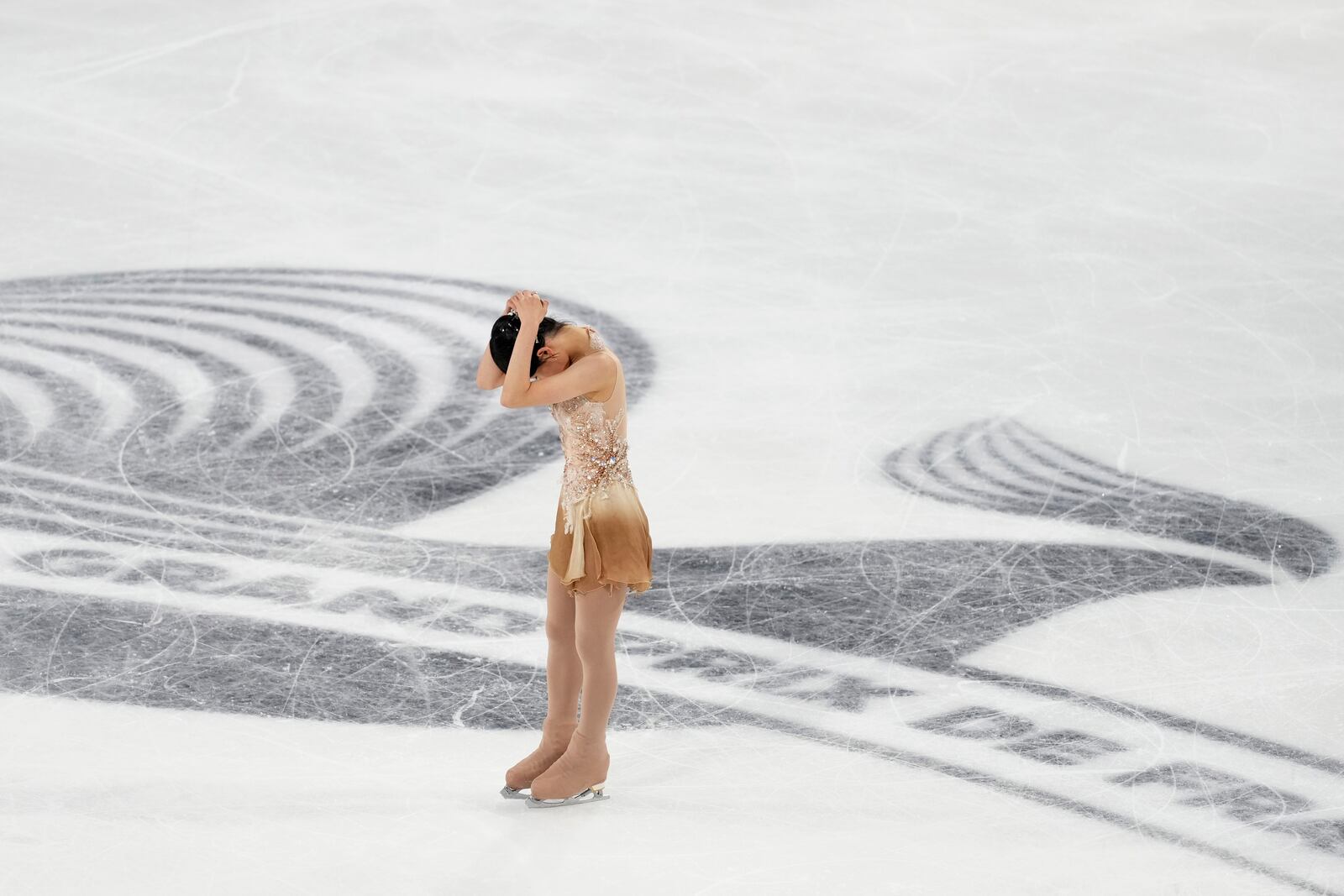 Chaeyeon Kim, of South Korea, reacts after competing in the women's free skating segment at the ISU Grand Prix of Figure Skating, Saturday, Nov. 2, 2024, in Angers, France. (AP Photo/Aurelien Morissard)